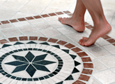 Bare feet walking on cleaned tile and grout