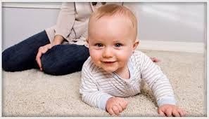 Mom and baby on freshly cleaned carpet, cleaned by Peace Frog Carpet and Tile Cleaning in Austin