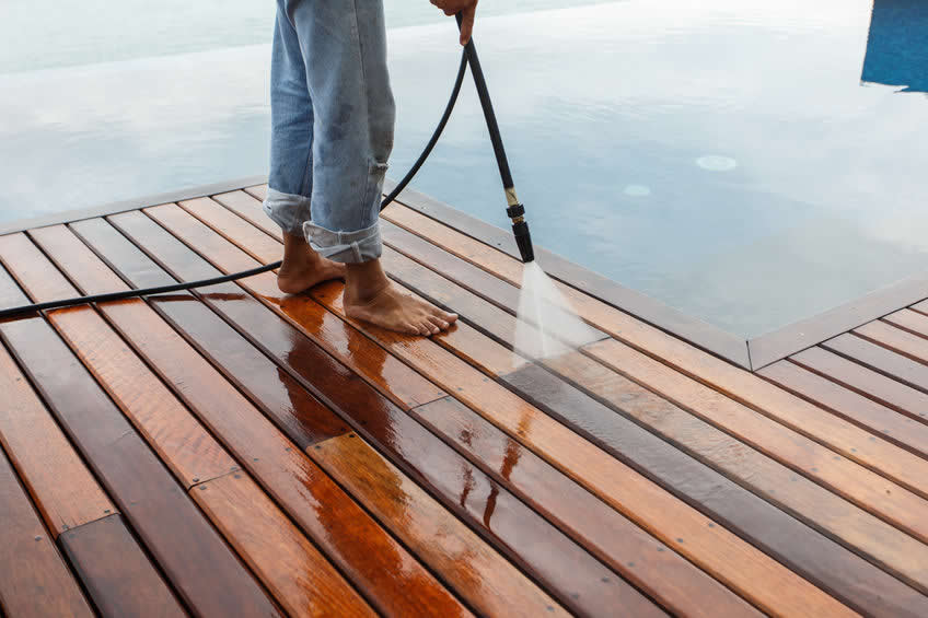 Man Pressure Washing the Deck in Austin Texas